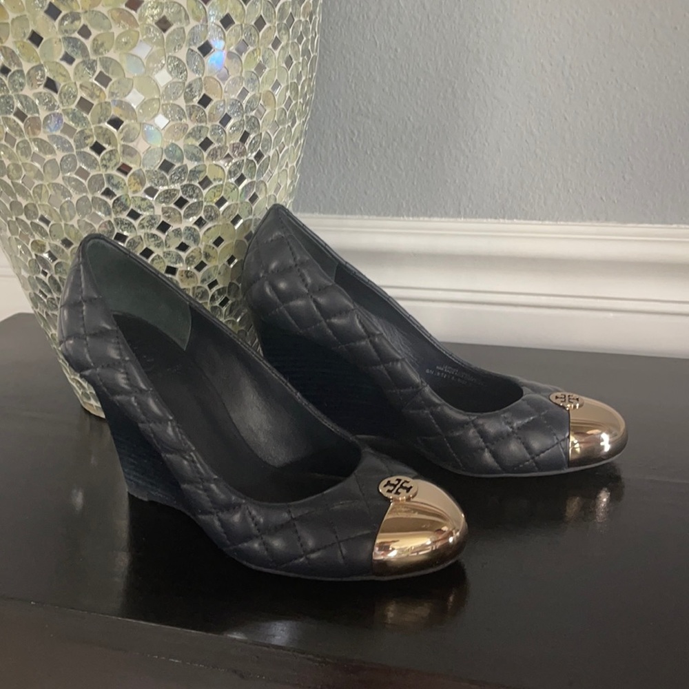 Tory Burch navy pumps.